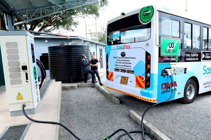 An electric bus charging at a depot in Kenya