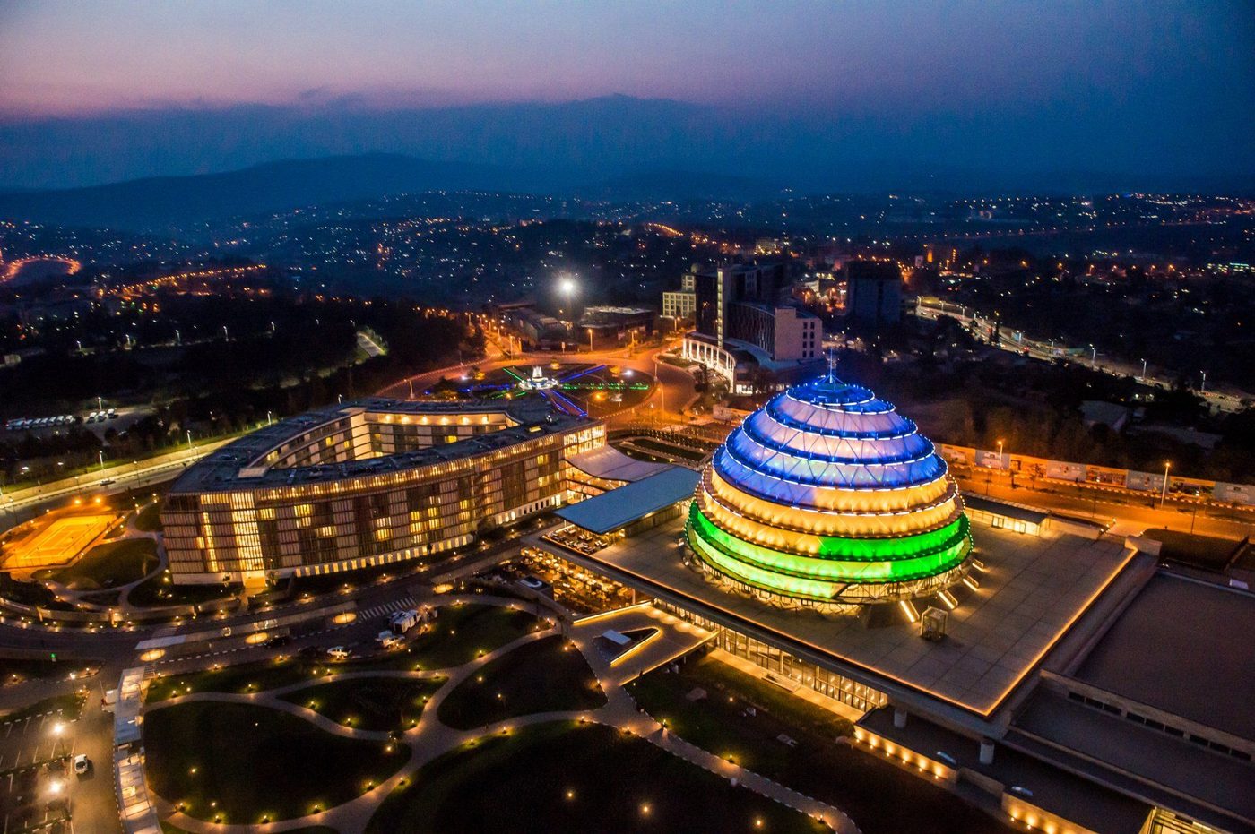 Kigali Convention Centre lit at dusk, an aerial view of Rwanda's capital